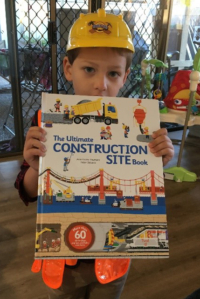Child with construction book