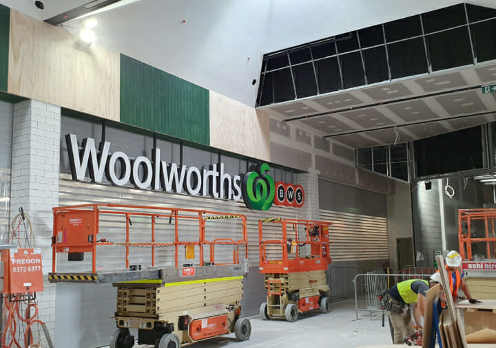 Caroline Sprints Woolworths in construction